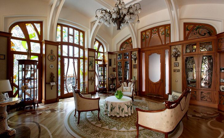 Просторная гостиная в стиле модерн. Изысканные плавные линии, отделка интерьера ценными породами дерева.Просторная гостиная в стиле модерн. Изысканные плавные линии, отделка интерьера ценными породами дерева.